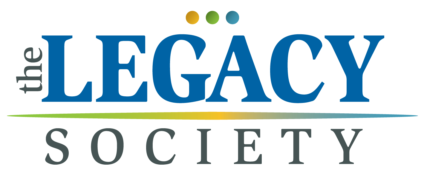 Logo for "The Legacy Society" with the word "the" vertically aligned to "Legacy" and three colored dots above the word "Legacy". A colored gradient line underlines the text.