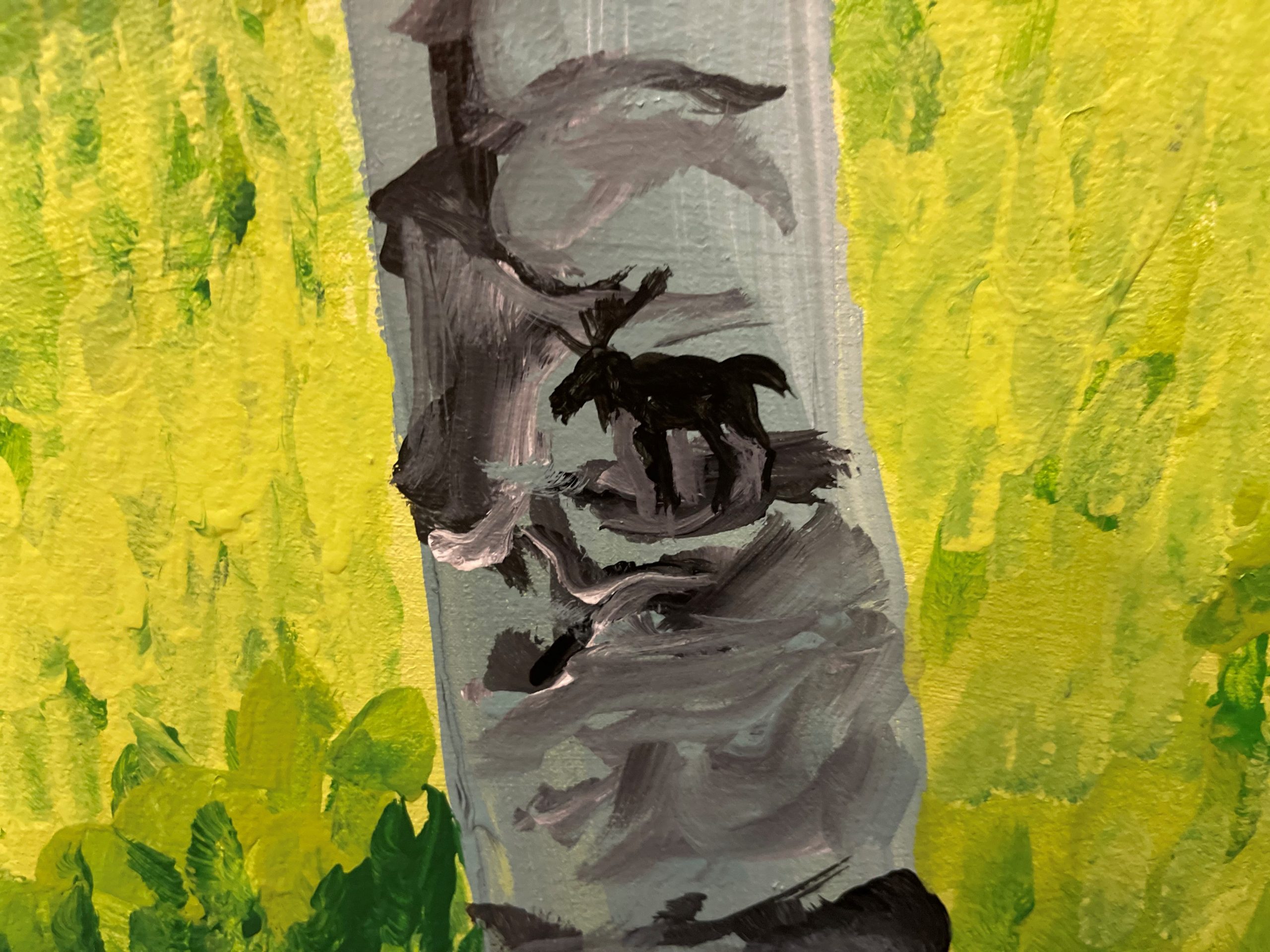 A painting depicts a grey tree trunk with a black silhouette of a moose against a yellow and green leafy background.