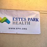 A banner on a wall displaying the logo and website for Estes Park Health (www.eph.org).